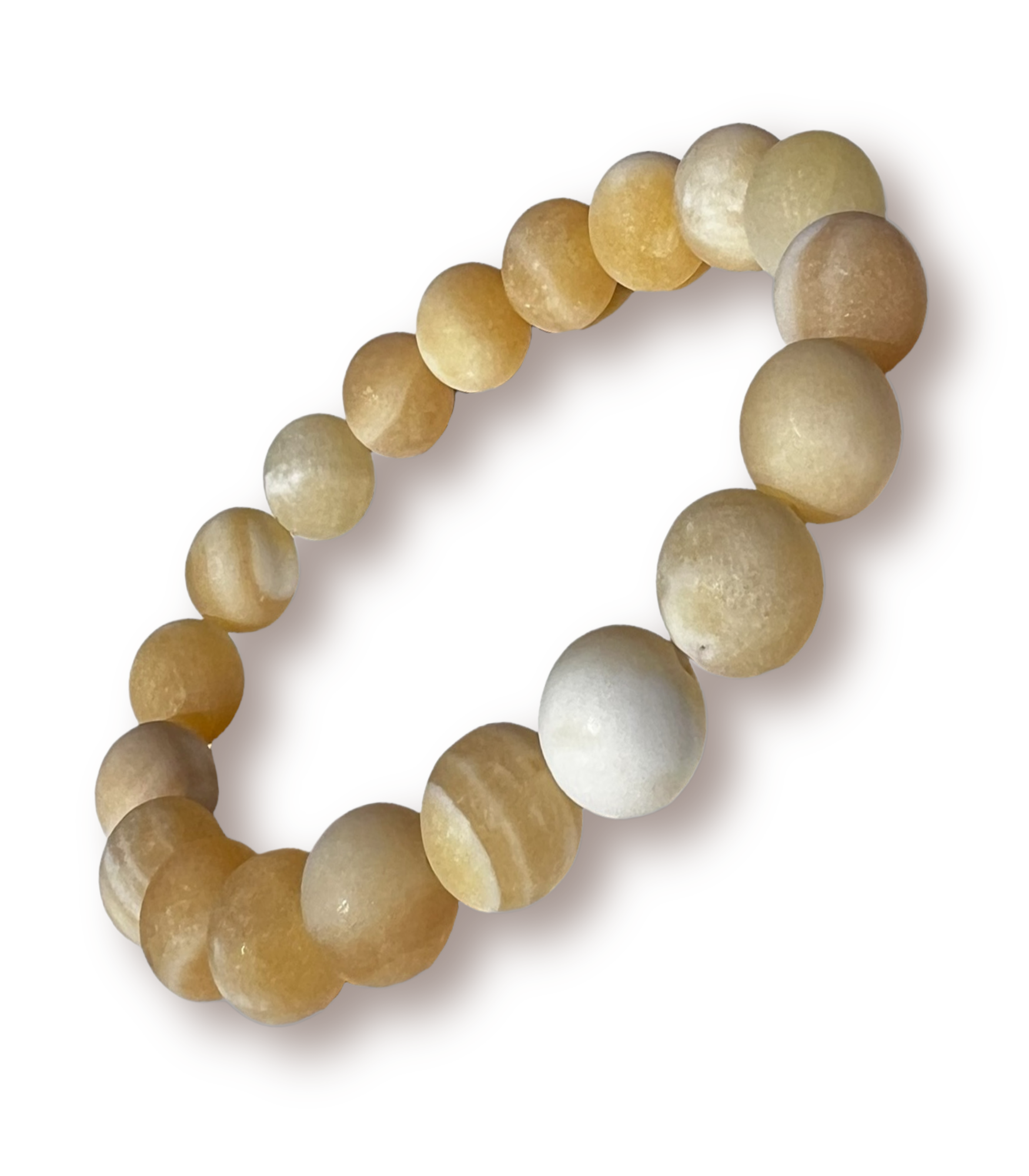 Beaded stretch bracelet made of smooth, polished oval beads in warm cream, honey, and light brown tones