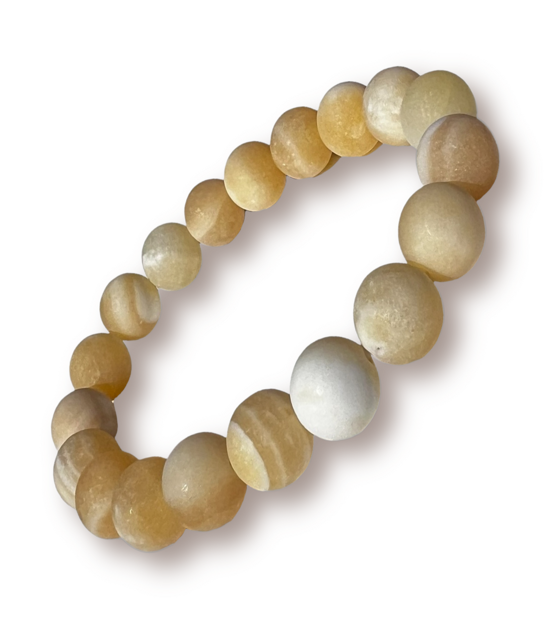 Beaded stretch bracelet made of smooth, polished oval beads in warm cream, honey, and light brown tones